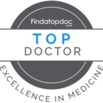 fatd-badge - Rose Medical Pavilion A circular award seal from Findatopdoc.com featuring the words "TOP DOCTOR" and "Excellence in Medicine."